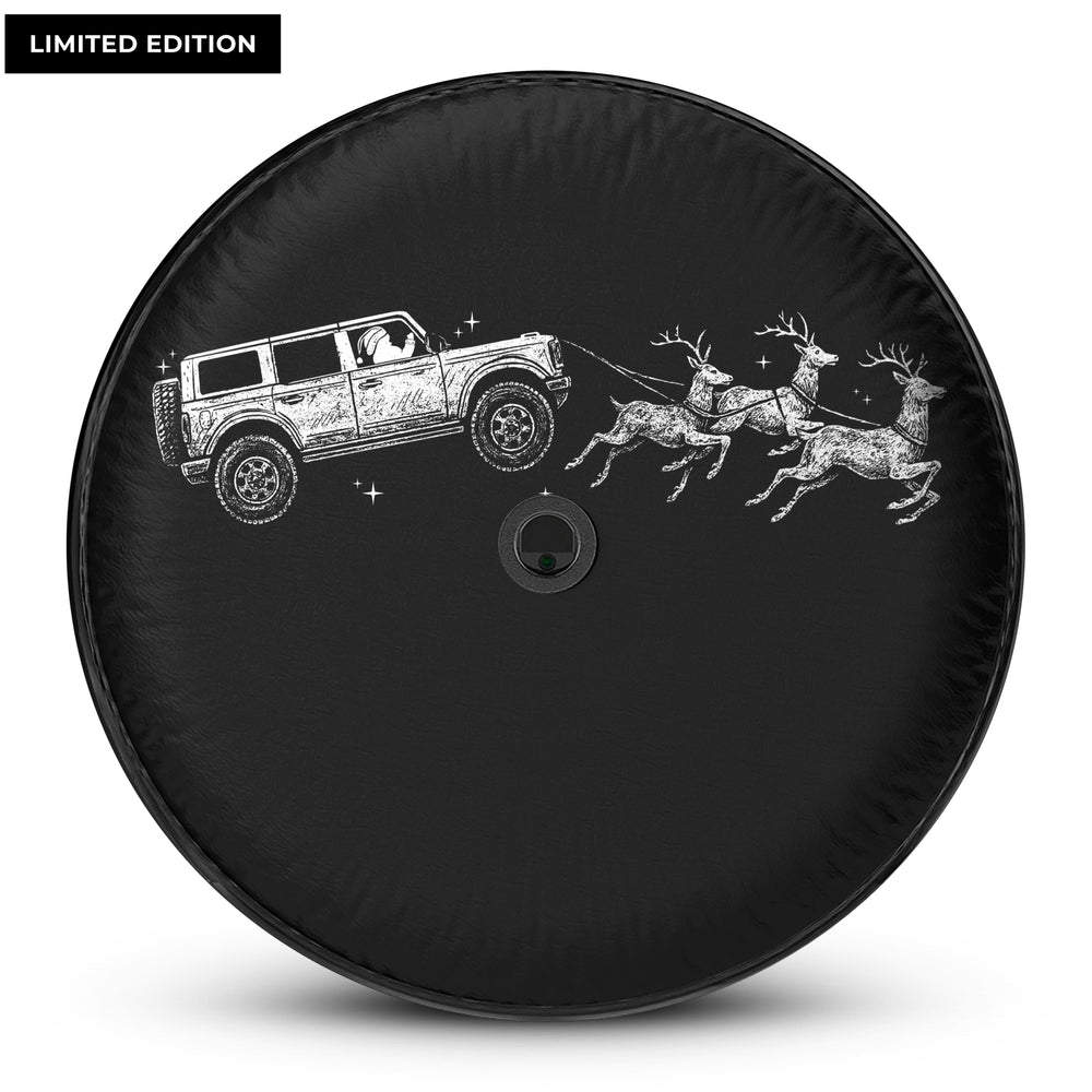 Santa driving a Ford Bronco pulling reindeer, Christmas-themed spare tire cover for Ford Bronco