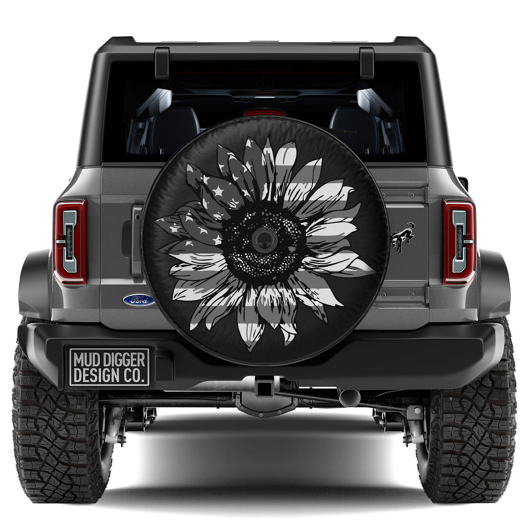 Sunflower Flag Tire Cover – Custom-fit, weatherproof spare tire cover with a patriotic sunflower design. Fits Ford Bronco. Durable, UV-resistant material.