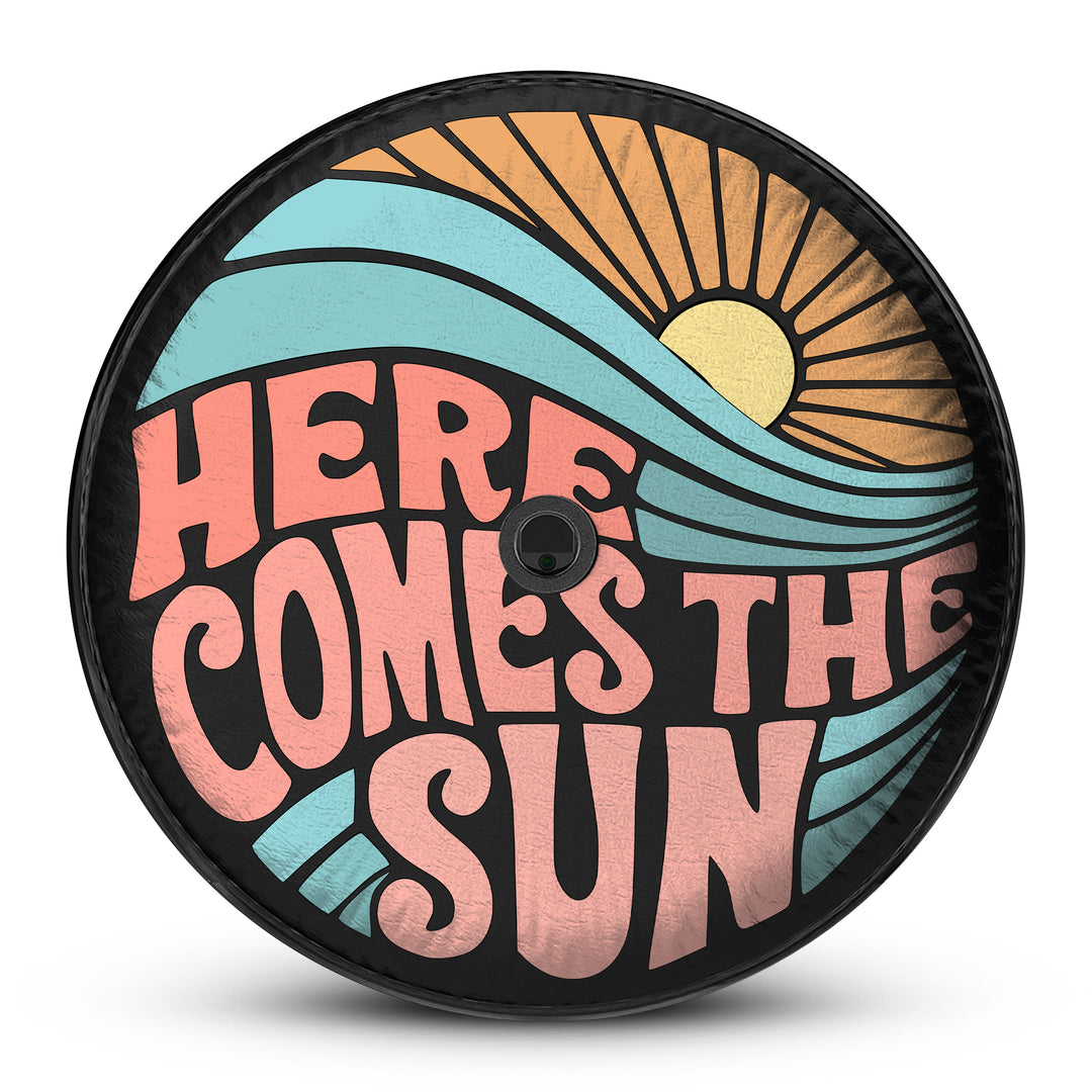 Here Comes the Sun Tire Cover – Custom-fit, weatherproof spare tire cover with a vibrant sun design. UV-resistant and durable for all terrains.